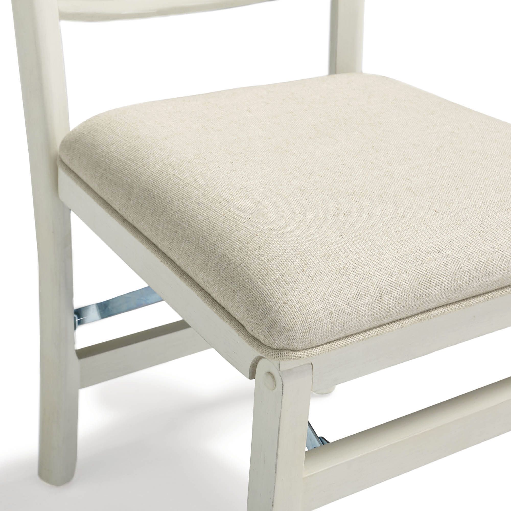 Close-up detail of the chair's wooden frame and seat.