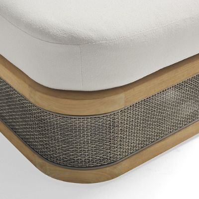 Close-up of the upholstered top and woven base of the ottoman.